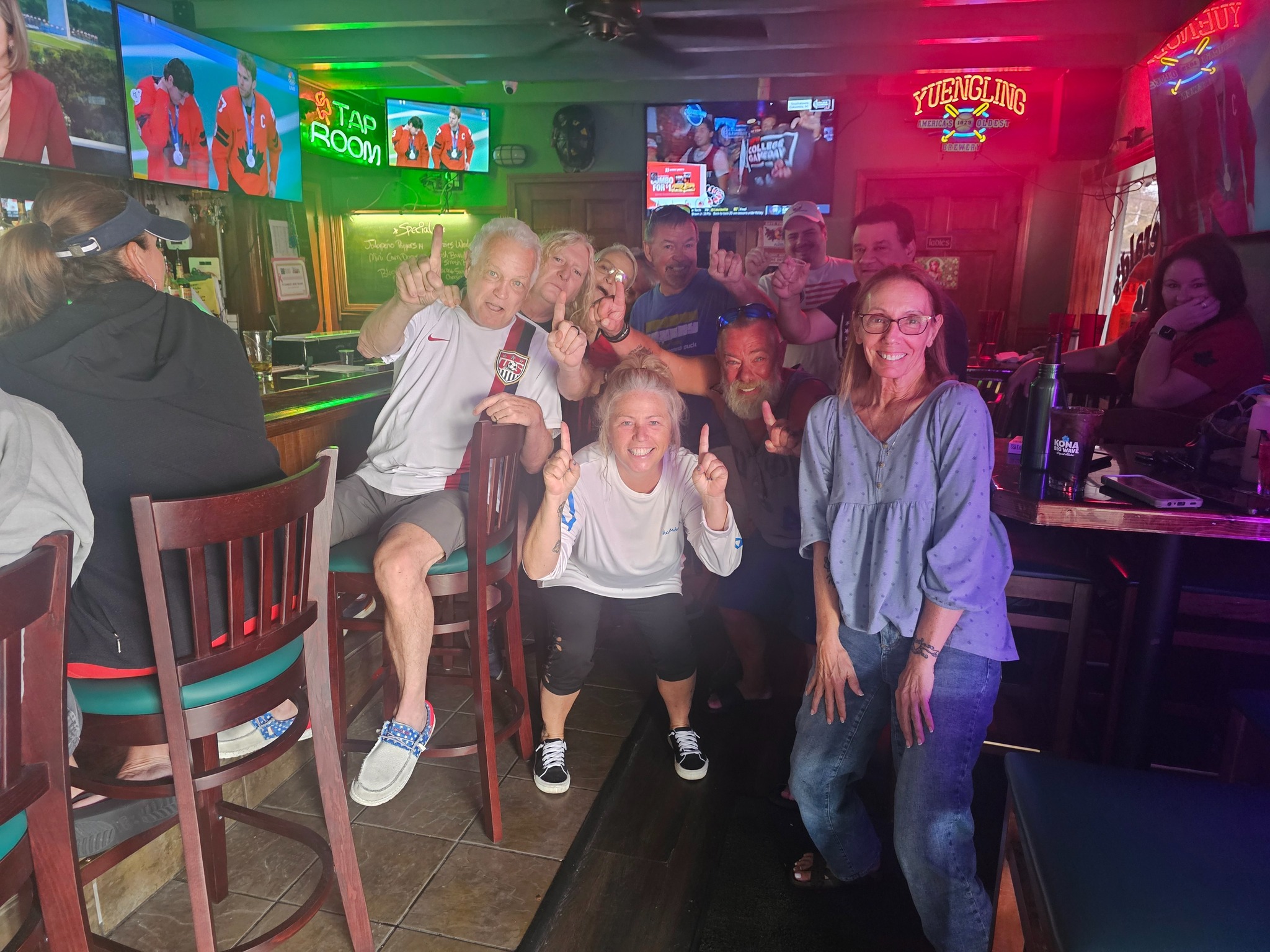 Sports fans watching the game at the bar