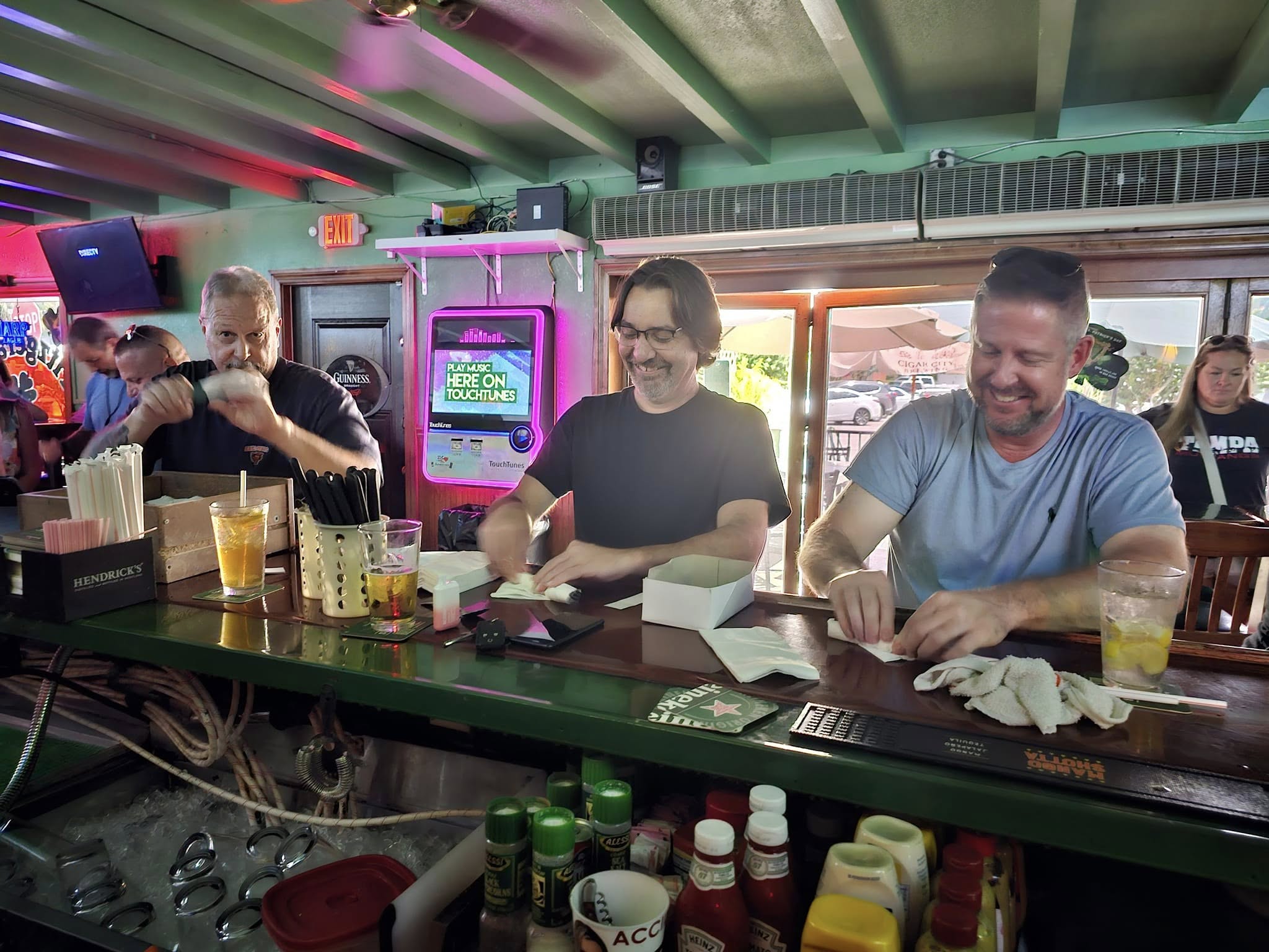 Regulars enjoying drinks at the bar